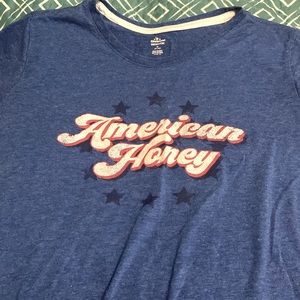 Blue,red, and white, it’s a normal patriotic shirt for ages (8-10)